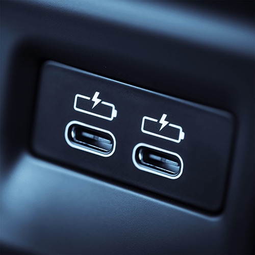 Two USB C ports inside a car.